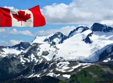 Canadian flag, snowy mountains. A\J AlternativesJournal.ca