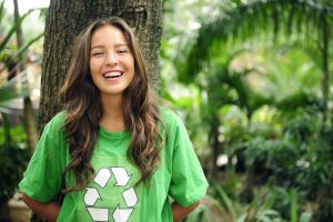 Girl in green recycle logo shirt A\J AlternativesJournal.ca