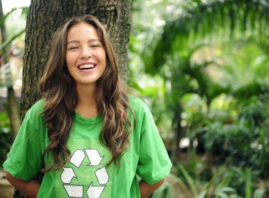 Girl in green recycle logo shirt A\J AlternativesJournal.ca