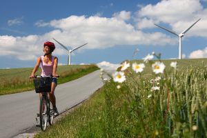 biking in denmark by windmills A\J AlternativesJournal.ca