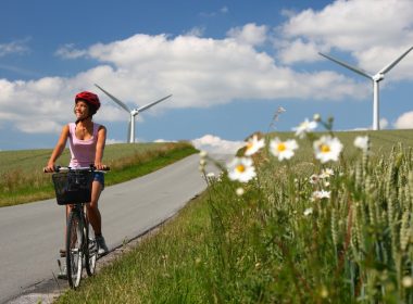 biking in denmark by windmills A\J AlternativesJournal.ca