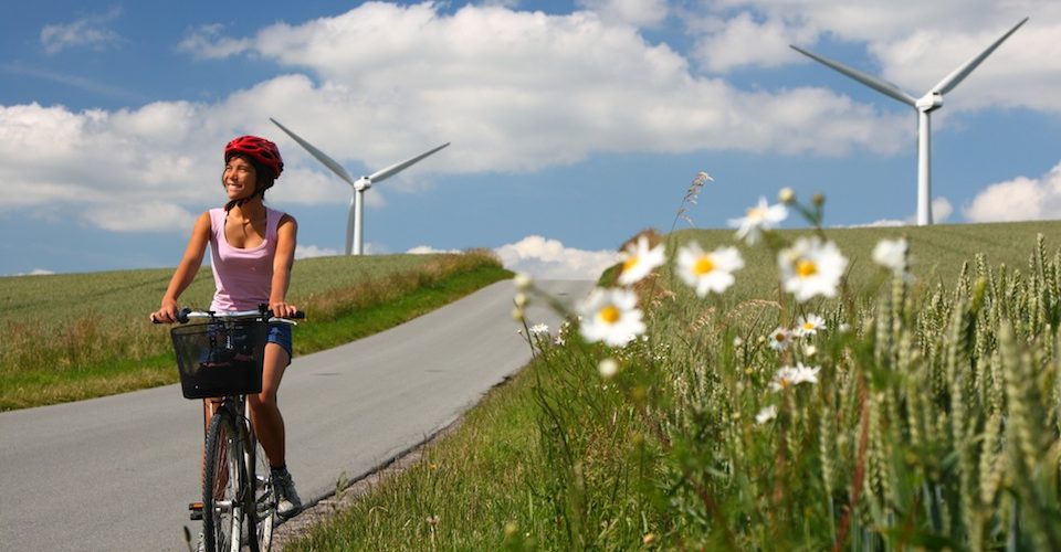 biking in denmark by windmills A\J AlternativesJournal.ca