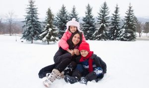 Family in snow A\J AlternativesJournal.ca