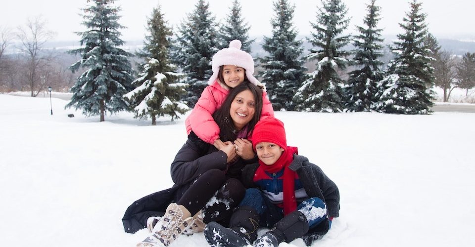 Family in snow A\J AlternativesJournal.ca
