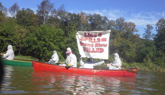 The "Climate Change Containment Unit" protesting Line 9 on the Grand River.