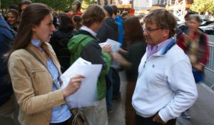 Woman and man having a conversation on the street. 