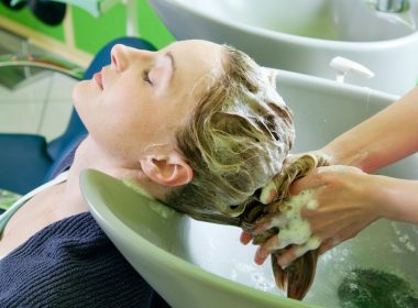 Woman getting her hair washed in a salon.