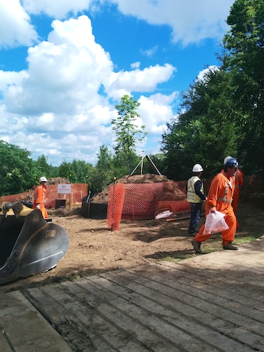 Enbridge construction workers leaving the site shortly after protesters arrived.