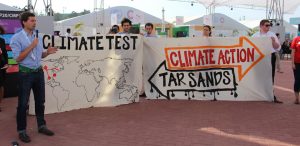 Activists with signs at COP20