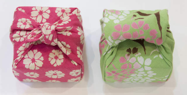 Gifts wrapped in fabric.