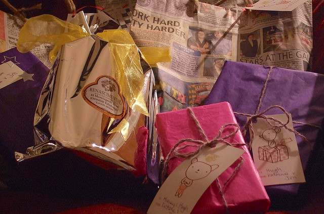 Presents wrapped in tissue and newspaper.