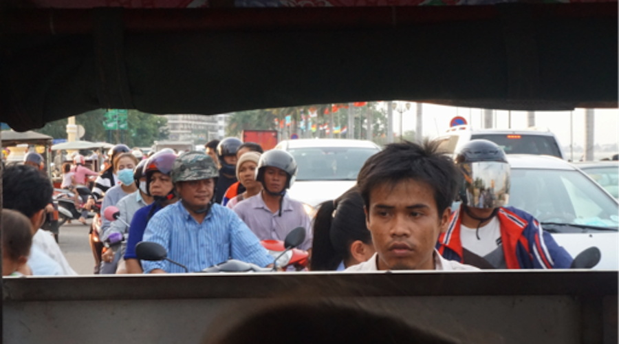 The view from a back window of a tuk-tuk in Phnom Penh